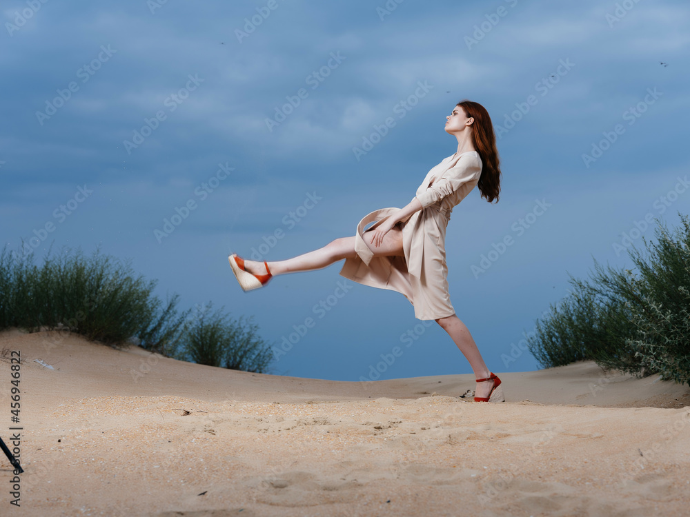 woman in coat sand summer lifestyle fashion woman in coat sand summer lifestyle fashion
