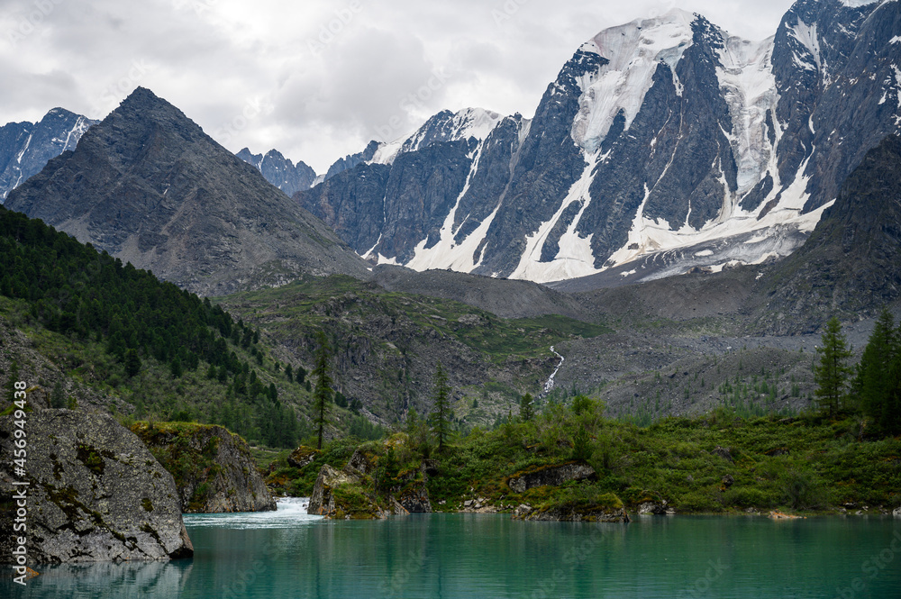 Blue water of a mountain lake. Beautiful mountain landscape. Shavlinsky lakes, Altai.
