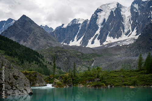 Blue water of a mountain lake. Beautiful mountain landscape. Shavlinsky lakes, Altai. 