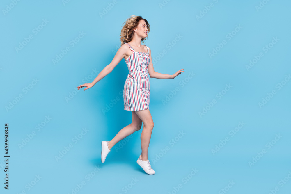 Full length body size photo woman running on meeting isolated pastel blue color background Full length body size photo woman running on meeting isolated pastel blue color background