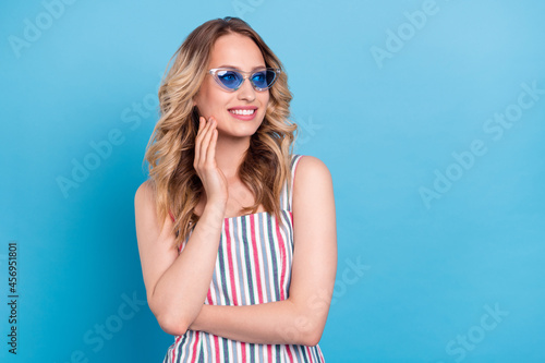 Photo portrait blonde woman in sunglass folded hands looking copyspace isolated pastel blue color background