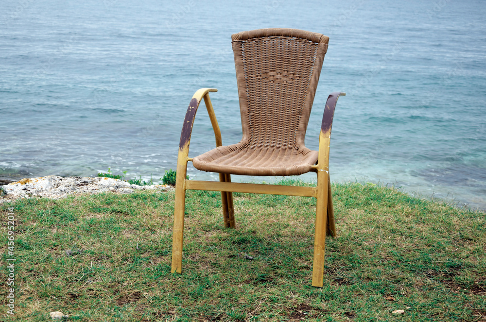 Wooden chair on the beach. Leisure and relax concept
