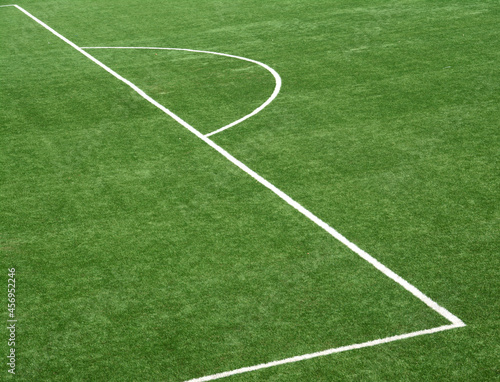 The geometric shapes drawn by the white lines of a football field.