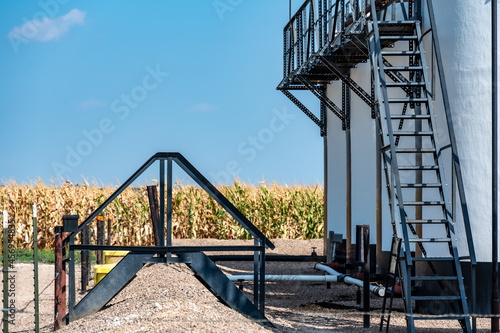 Ramp and stairs over a secondary containment dike for chemical oil storage confined space photo