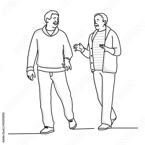 Two elderly men walk talking.