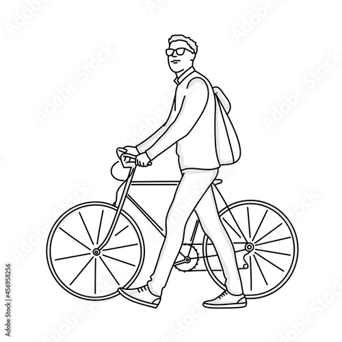 Young guy with a backpack on his back walks with a bicycle.