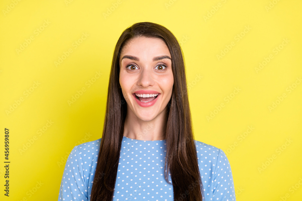 Fototapeta premium Photo of funny impressed young woman dressed blue clothes big eyes open mouth smiling isolated yellow color background