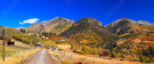 Panoramic view of Colorful fall foliage on slopes of San Juan mountains along Last Dollar Road in rural Colorado