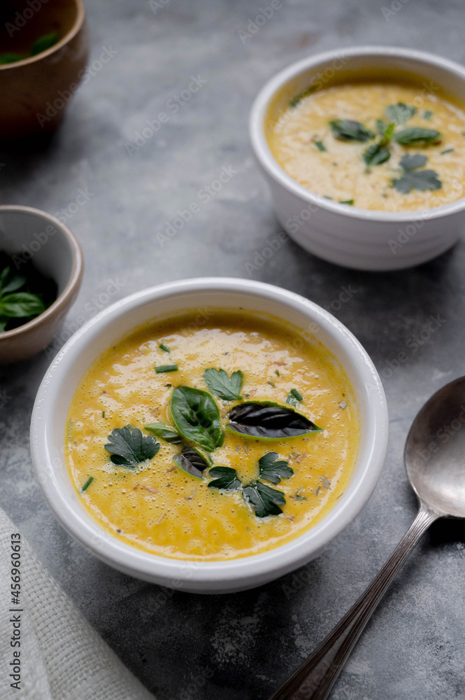 Pumpkin soup made from fresh orange butternut with coconut milk. Delicious vegan, seasonal autumn food. Pumpkin soup made from fresh orange butternut with coconut milk. Delicious vegan, seasonal autumn food.