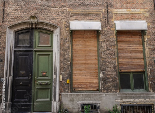 old door and windows in a brick building
