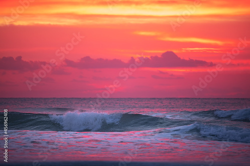 Beautiful sunrise over the sea and beach