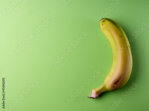 Yellow banana green background