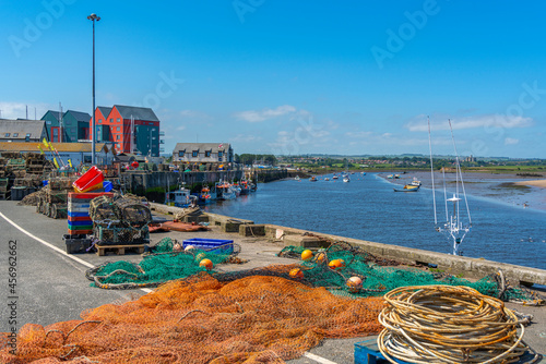 View of fishing nets on quayside and River Coquet at Amble, Morpeth, Northumberland