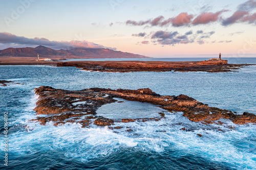 Crashing waves in the rough sea at Punta Jandia lighthouse (Faro de la Lola), Fuerteventura, Canary Islands photo