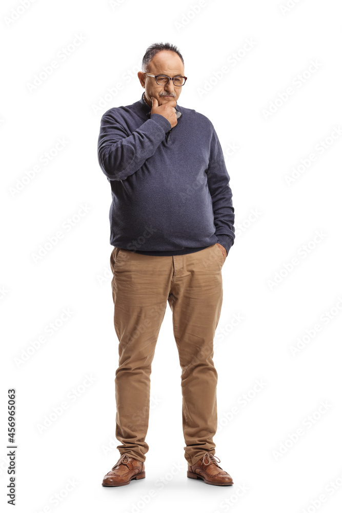 Full length portrait of a pensive mature man standing and thinking Full length portrait of a pensive mature man standing and thinking
