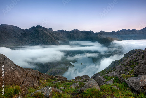 Early morning clouds drifting over the hills flowing down to Loch Coruisk below with the Cuillin Ridge in the background, Isle of Skye photo