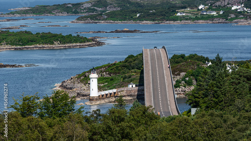 The Skye Bridge over Loch Alsh, connecting the Isle of Skye to Eilean Ban and the mainland, with Kyleakin Lighthouse on the island photo