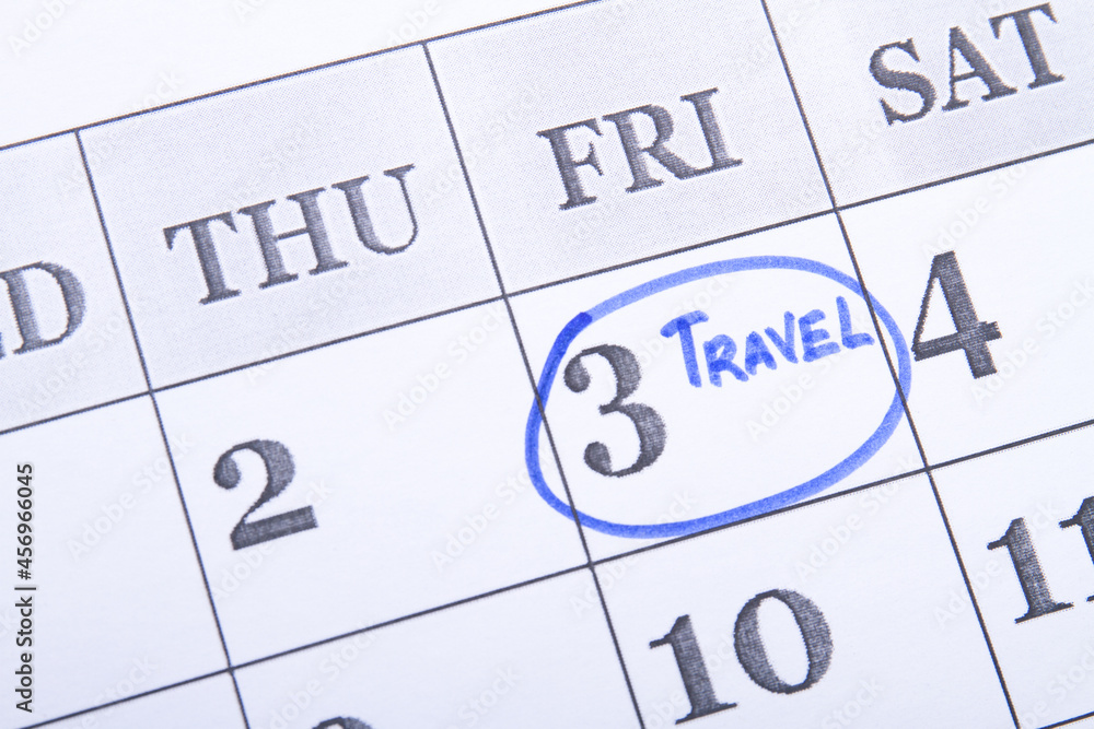 Travel day marked in a calendar with a blue felt-tip pen. Travel day marked in a calendar with a blue felt-tip pen.