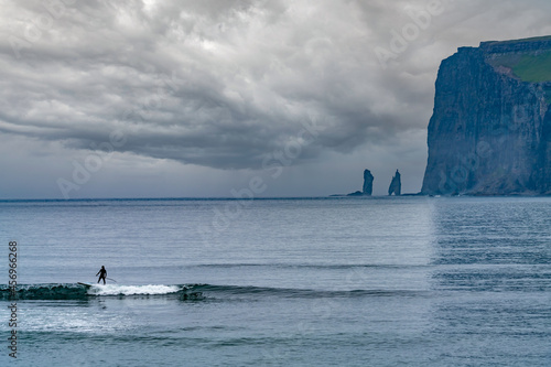 Paddle surfing on the northern coast of the island of Streymoy, near Tjornuvik, Faroe Islands