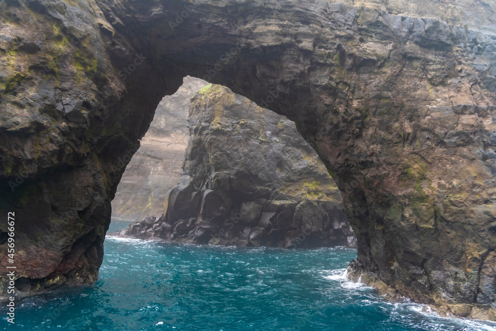 Stunning boat ride among the  steep bird cliffs, caves, narrow straits and grottoes of Vestmanna, Streymoy island, Faroe Islands