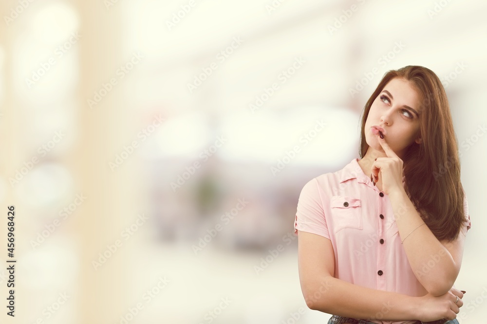 Fototapeta premium Lifestyle, beauty and fashion. Thoughtful young girl searching for a solution