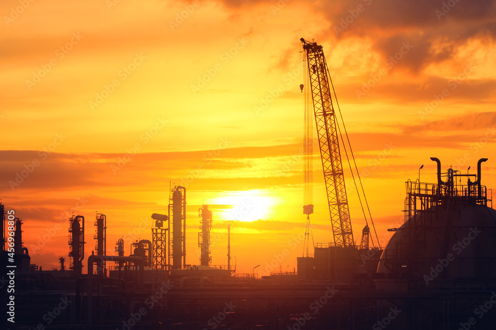 Petroleum industry plant with sunset sky, Silhouette image of petrochemical industrial plant