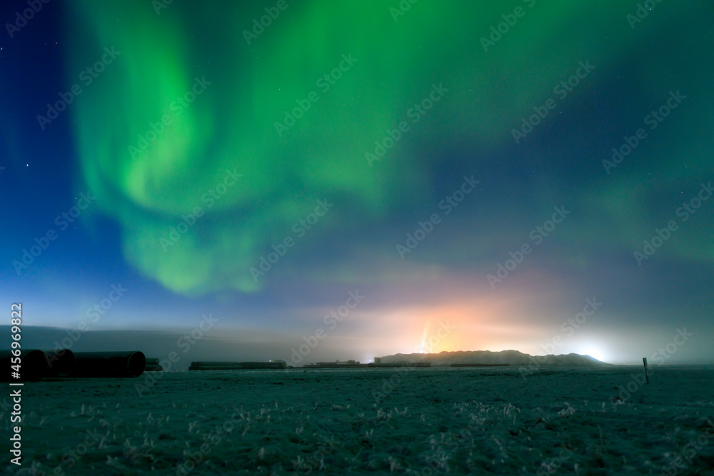 Northern Lights at night sky. Aurora Borealis beautiful polar lights in sky with stars.