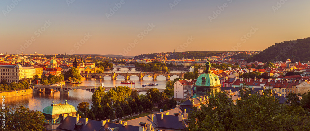 view of the old city of Prague with the Vltava River, bridges and towers, at sunset, Prague, Czech republic - obrazy, fototapety, plakaty 