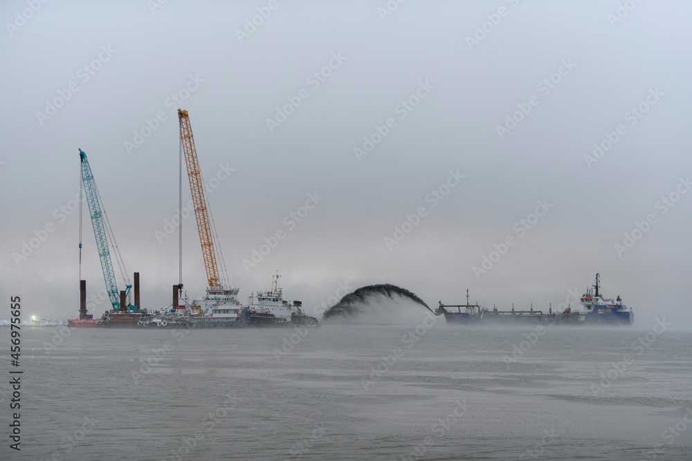 Ταπετσαρία Vessel engaged in dredging at sunset time
