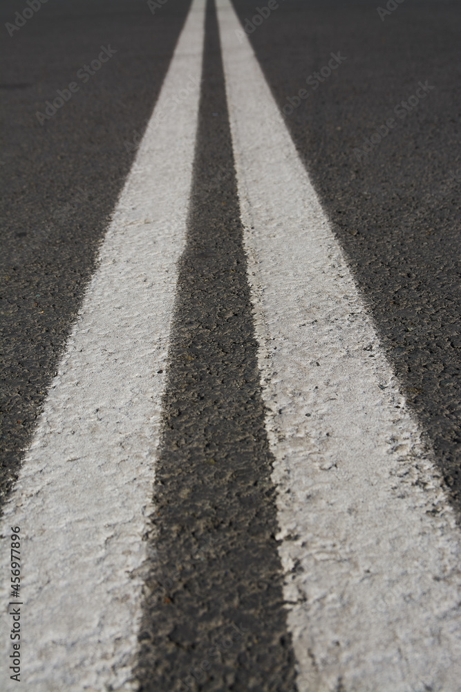 White double dividing strip on the road. Perspective. White double dividing strip on the road. Perspective.