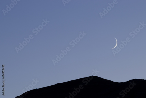 new moon over the mountains