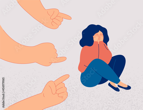 Sad girl suffers from psychological abuse from her peers. Weeping woman surrounded by hands with index fingers pointing at her. Public censure and victim-blaming. Bullying concept.