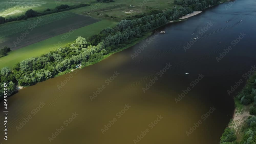 Drone. Fly over the river, country houses. Boats sail along the river. People are swimming. Island Drone. Fly over the river, country houses. Boats sail along the river. People are swimming. Island