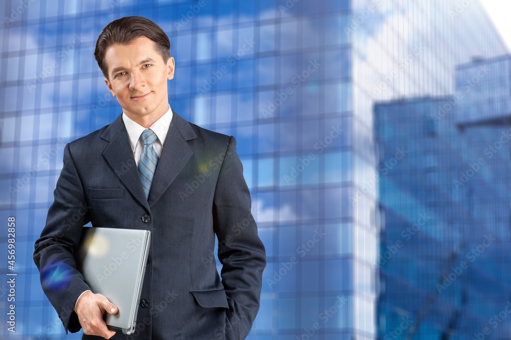 Photo of smart cool happy man hold laptop computer Photo of smart cool happy man hold laptop computer