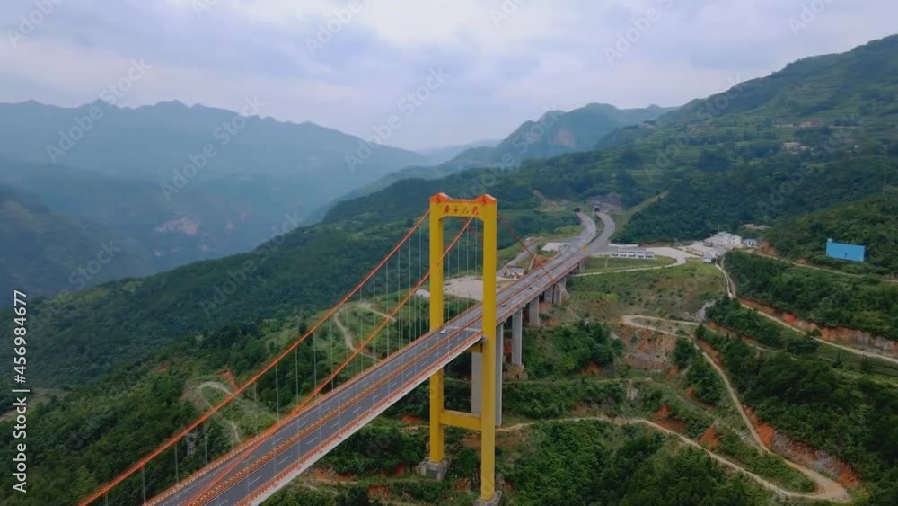 Puli Bridge or Pulihe Bridge is a bridge that crosses the Puli Canyon of the Gesiang River, located in the Qujing City District, China. (aerial photography) Puli Bridge or Pulihe Bridge is a bridge that crosses the Puli Canyon of the Gesiang River, located in the Qujing City District, China. (aerial photography)