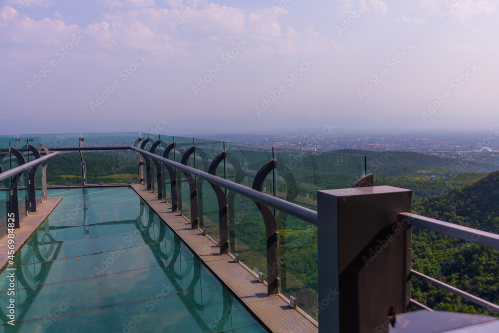 SATAPLIA, KUTAISI, GEORGIA: View to glass bottomed observation platform with clear floor of state Sataplia reserve. SATAPLIA, KUTAISI, GEORGIA: View to glass bottomed observation platform with clear floor of state Sataplia reserve.