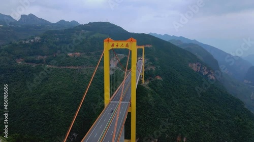 Puli Bridge or Pulihe Bridge is a bridge that crosses the Puli Canyon of the Gesiang River, located in the Qujing City District, China. (aerial photography) photo