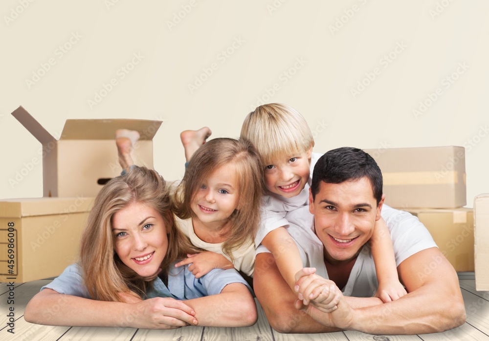 Happy young attractive couple man and woman with carton package move in new house. Happy young attractive couple man and woman with carton package move in new house.