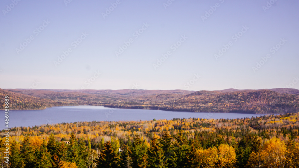 Beautiful autumn scenery lake image with trees in fall colors