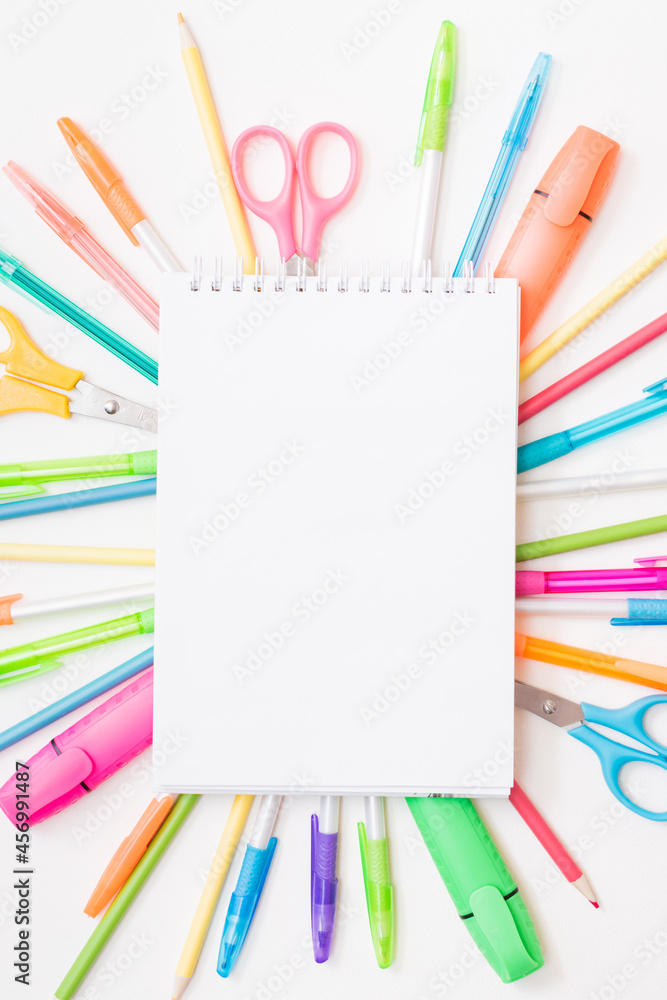 White open notebook mockup with flat lay school and office supplies on a white background White open notebook mockup with flat lay school and office supplies on a white background