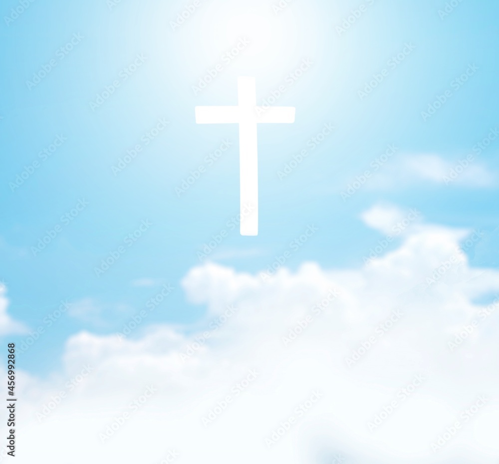 Christian cross appears bright in the sky background and clouds. Christian cross appears bright in the sky background and clouds.