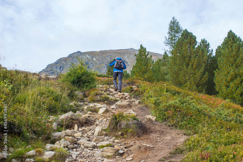 man trekking in the mountains, Alps in Austria, Steiermark man trekking in the mountains, Alps in Austria, Steiermark
