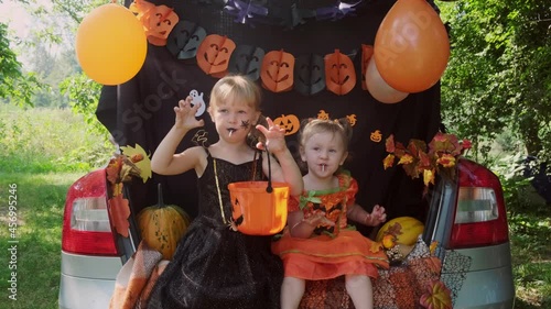 Kids scares and making Boo. Halloween concept. Trick or trunk