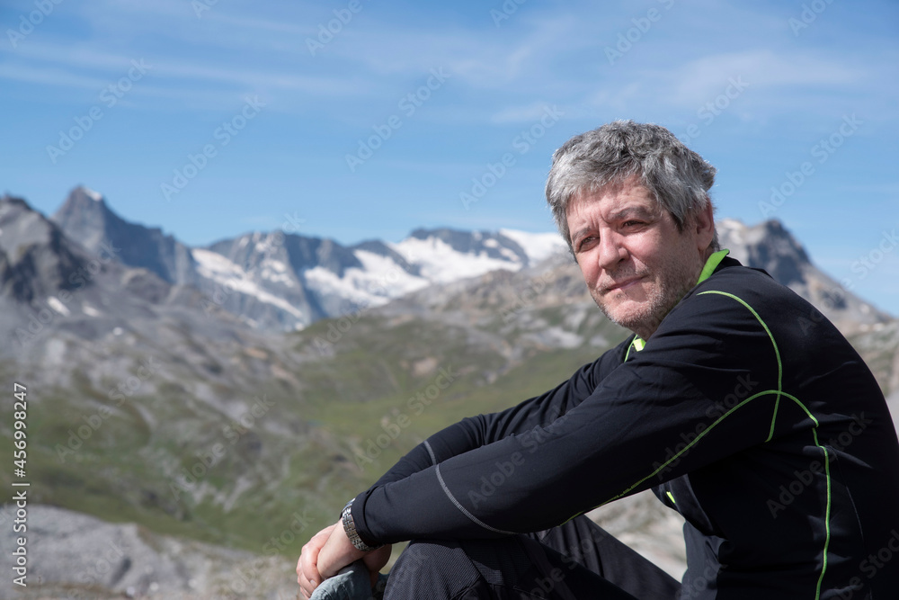 Portrait of a man hiking in the mountains in summer Portrait of a man hiking in the mountains in summer