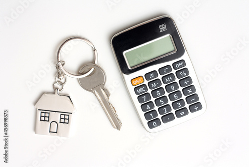 Calculator with a house key Stock Photograph, real estate, finance