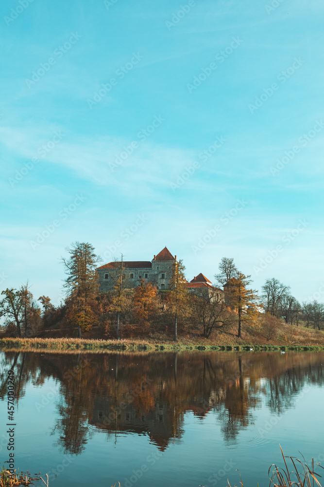 Fototapeta premium view of old european castle lake in front