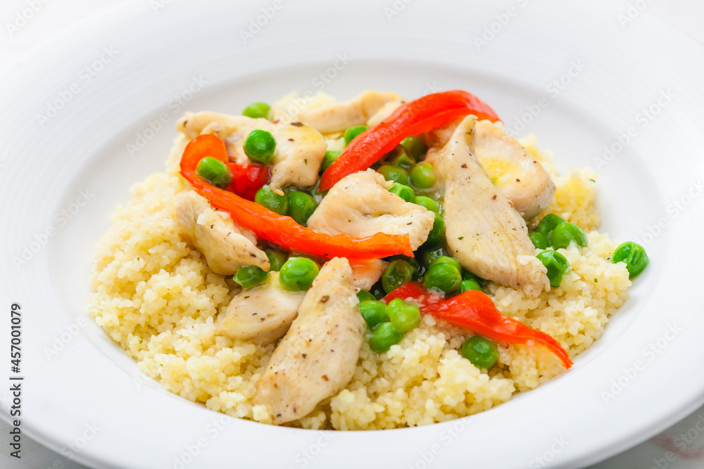 poultry meat with green peas, red pepper and couscous poultry meat with green peas, red pepper and couscous