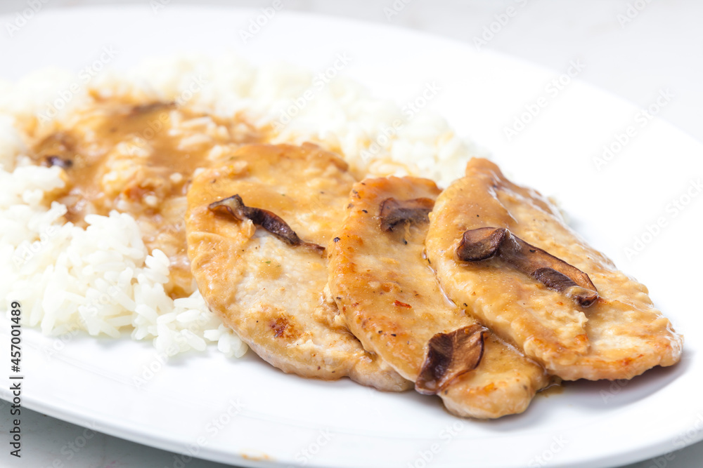 poultry meat with mushroom sauce and rice poultry meat with mushroom sauce and rice