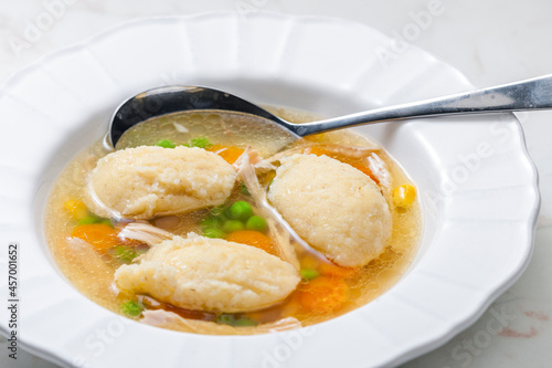 chicken broth with semolina dumplings and vegetables