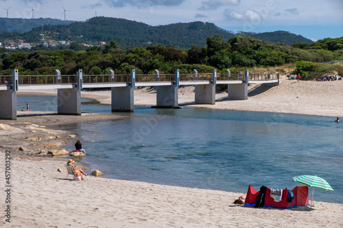 People enjoying the good weather on the banks of the Ancora River, beach of Vila Praia de Ancora. Municipality of Caminha, Portugal. © Vic